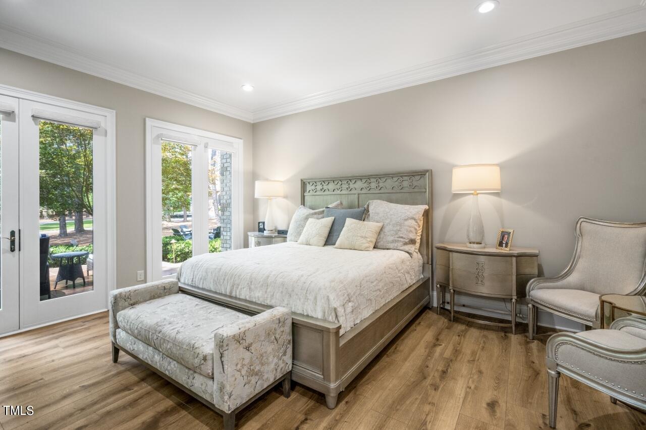 19 Pinewild Drive Pinehurst, NC 28374 - Photo 18 of 44 a bedroom with a bed and wooden floor