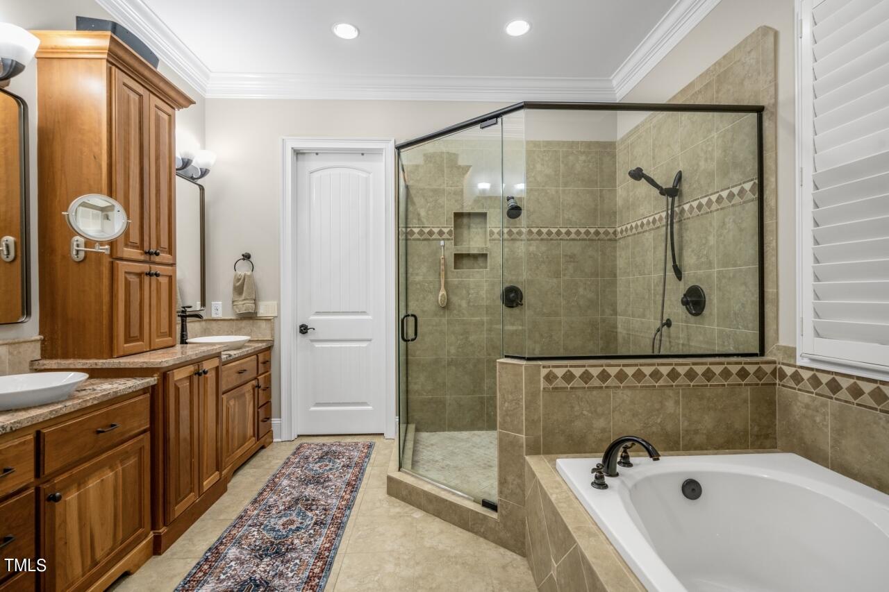 19 Pinewild Drive Pinehurst, NC 28374 - Photo 21 of 44 a bathroom with a bathtub and a shower