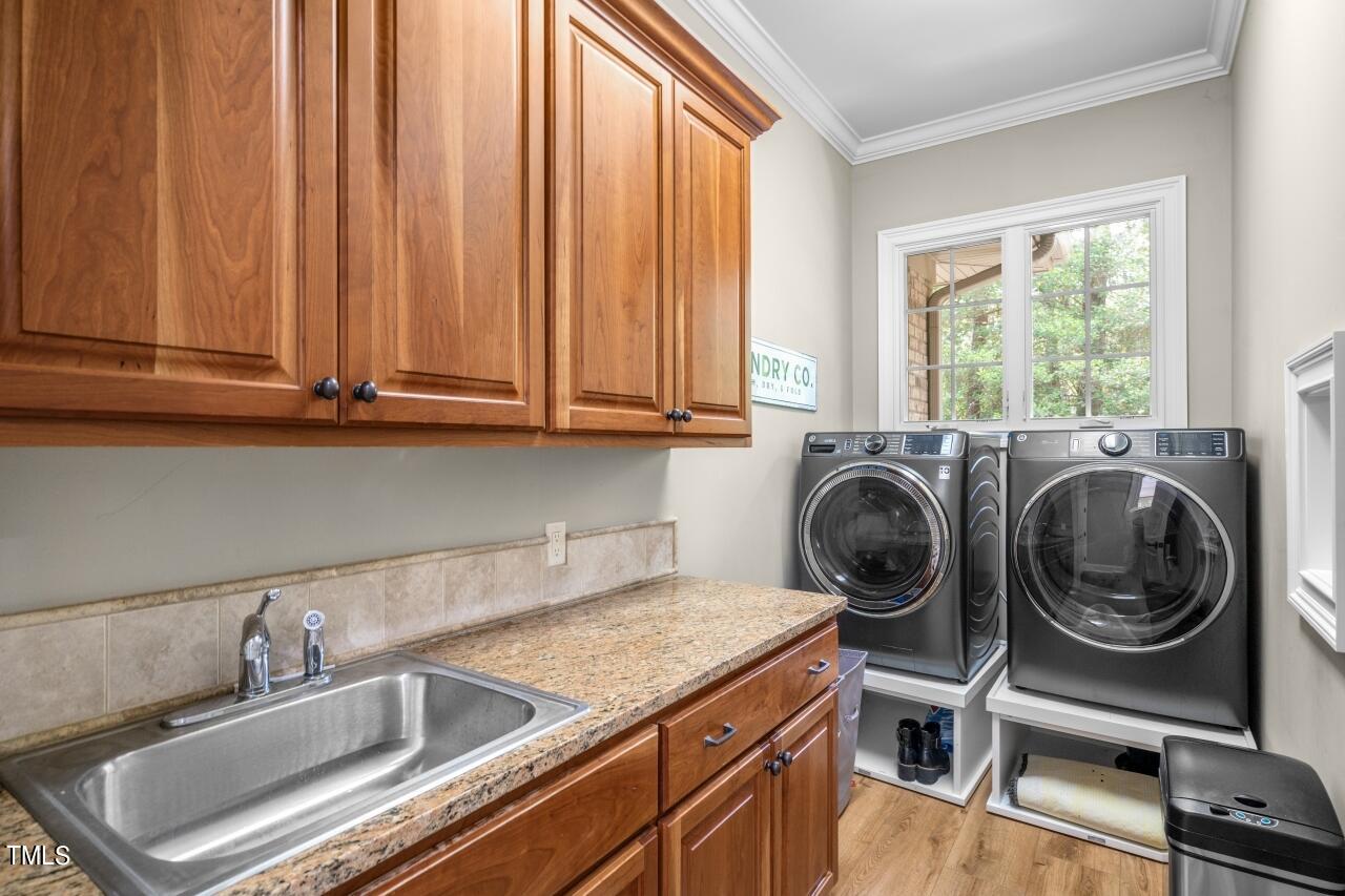 19 Pinewild Drive Pinehurst, NC 28374 - Photo 24 of 44 a utility room with sink dryer and washer