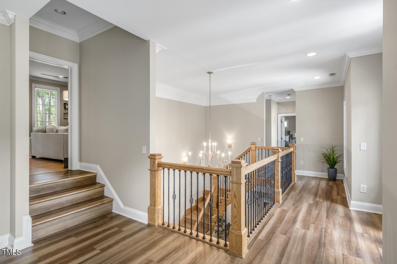 19 Pinewild Drive Pinehurst, NC 28374 - Photo 26 of 44 a view of a hallway with wooden floor and staircase