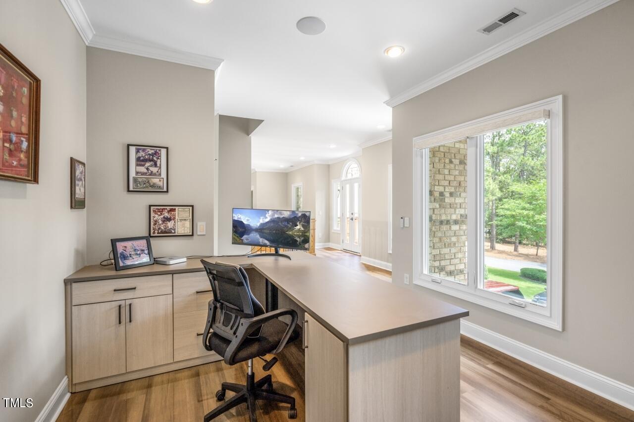 19 Pinewild Drive Pinehurst, NC 28374 - Photo 30 of 44 a view of a workspace with furniture and a window