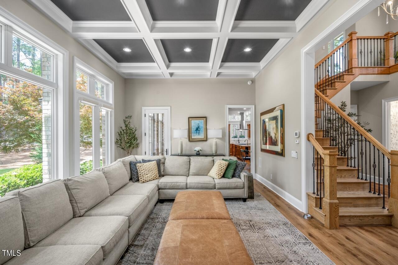 19 Pinewild Drive Pinehurst, NC 28374 - Photo 8 of 44 a living room with furniture ceiling fan and a rug