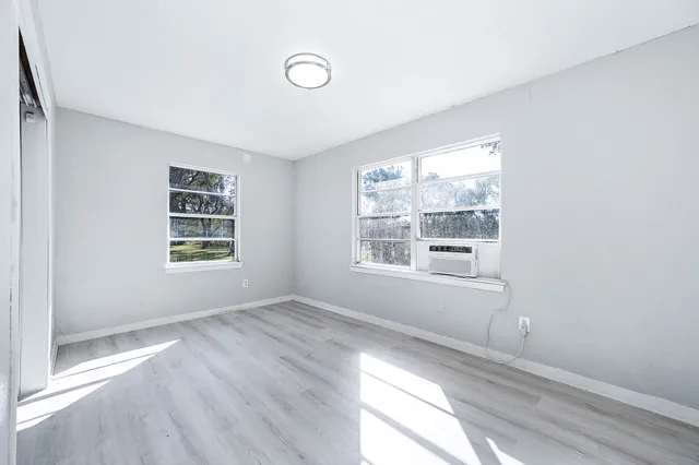 a view of an empty room with a window