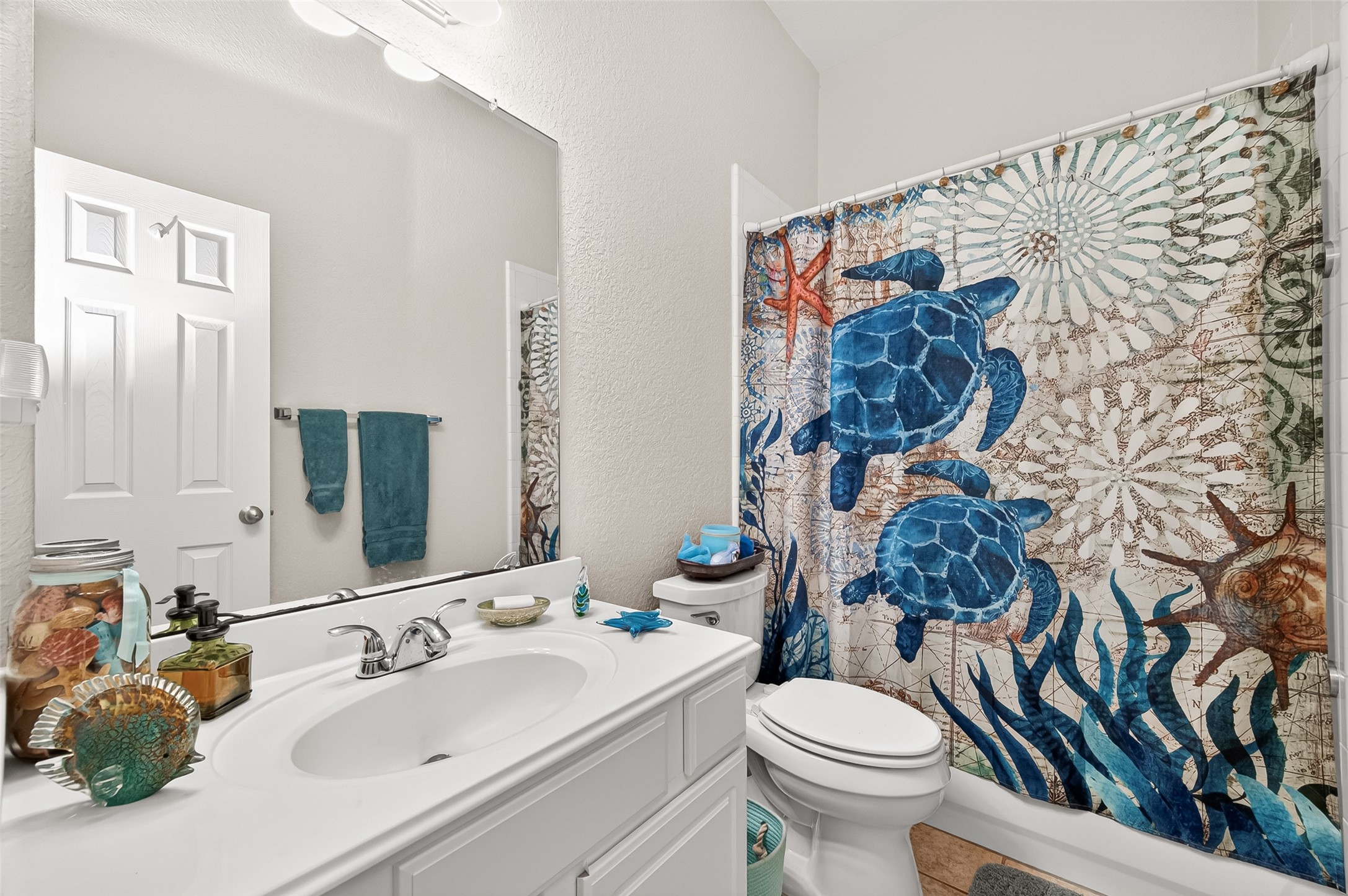 12455 West Summerlin Conroe, TX 77302 - Photo 17 of 31 a bathroom with a sink toilet and shower
