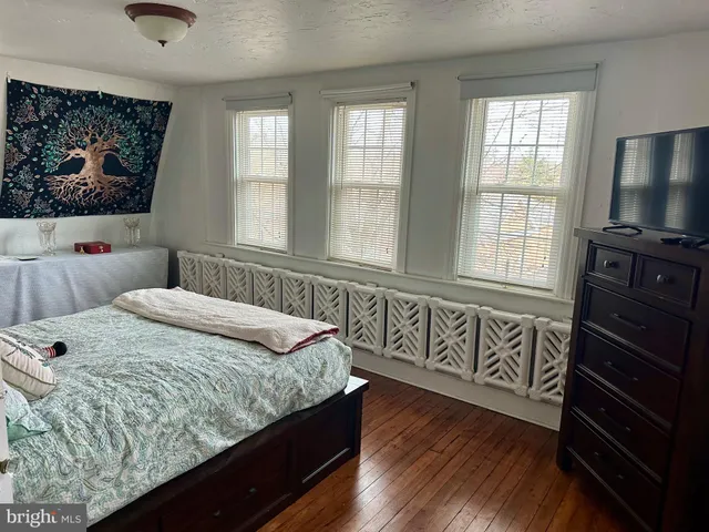 a living room with couch and a window