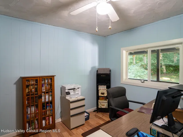 a workspace with furniture and a window