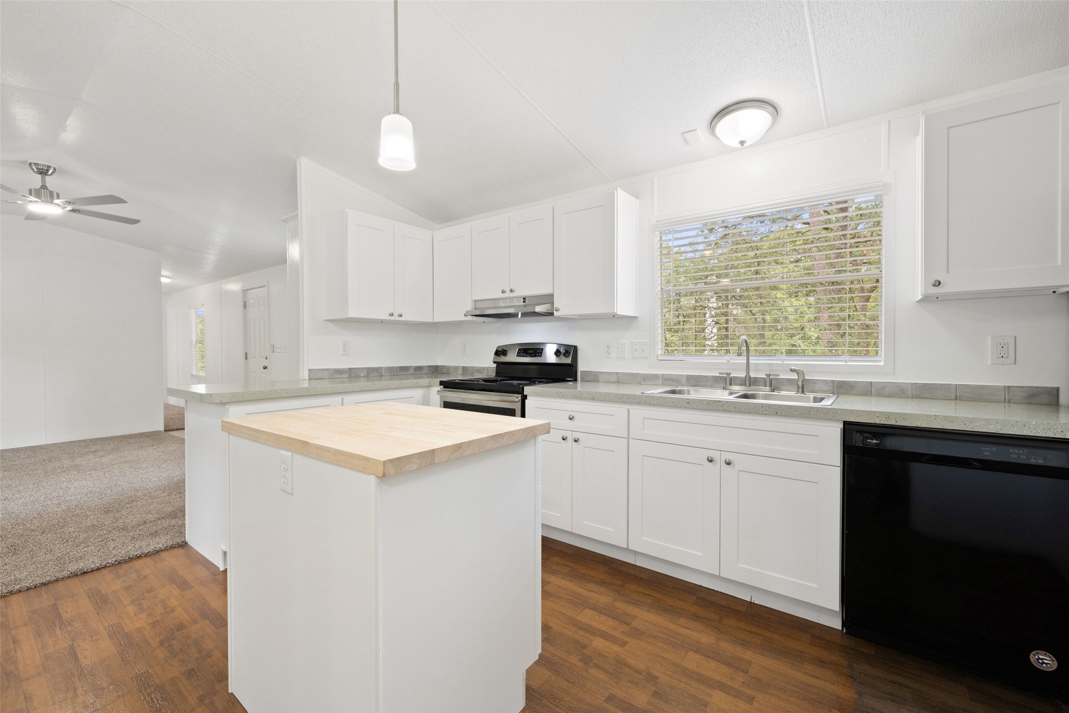 301 Porter Road, Unit A Bastrop, TX 78602 - Photo 5 of 28 a kitchen with a sink window and cabinets