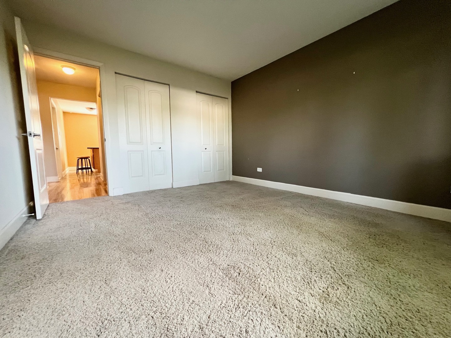 2219 Nichols Road, Unit 17A Arlington Heights, IL 60004 - Photo 6 of 19 a view of an empty room and a gallery