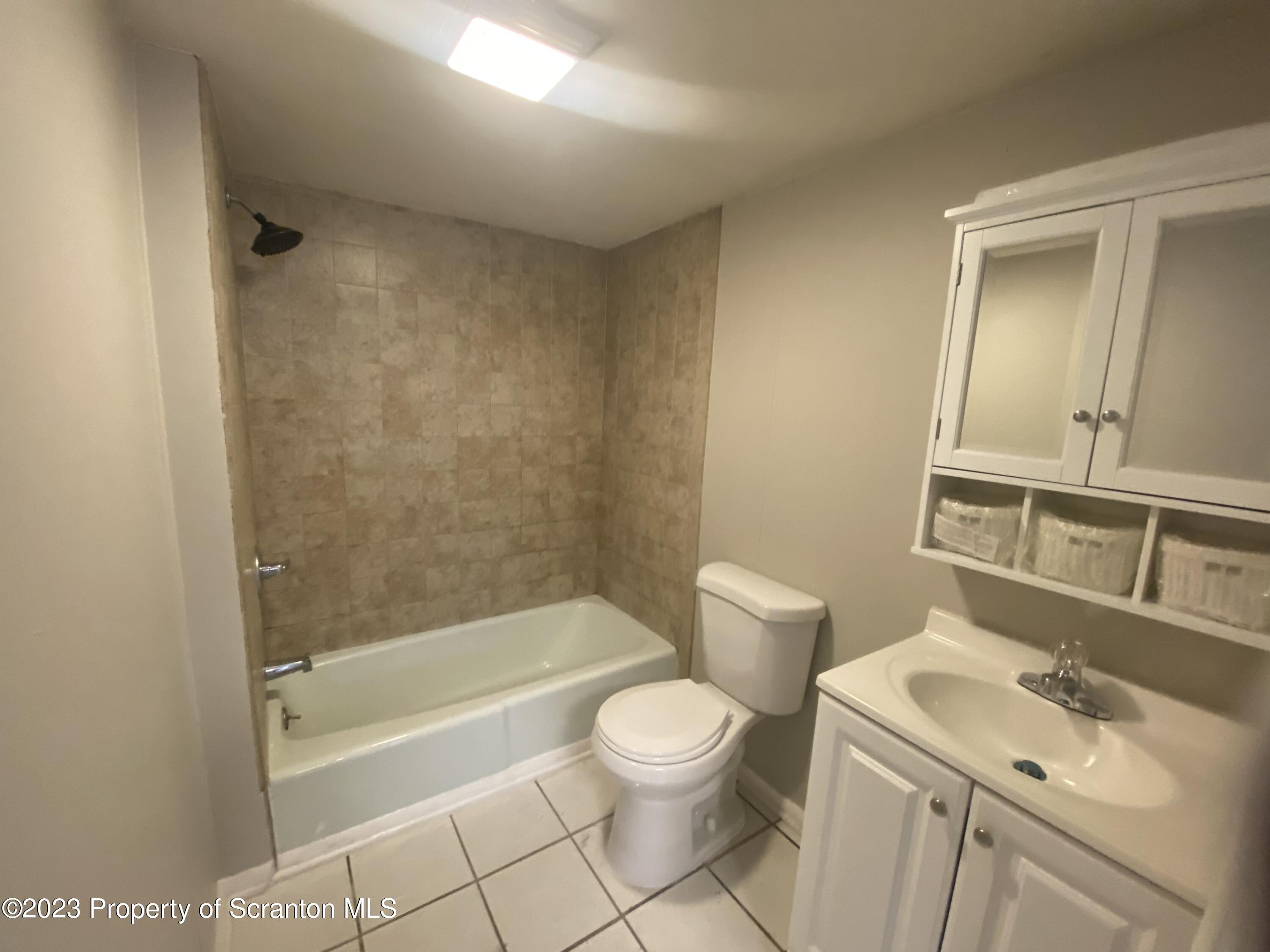 2513 North Main Avenue Scranton, PA 18508 - Photo 16 of 17 a bathroom with a sink a toilet and shower
