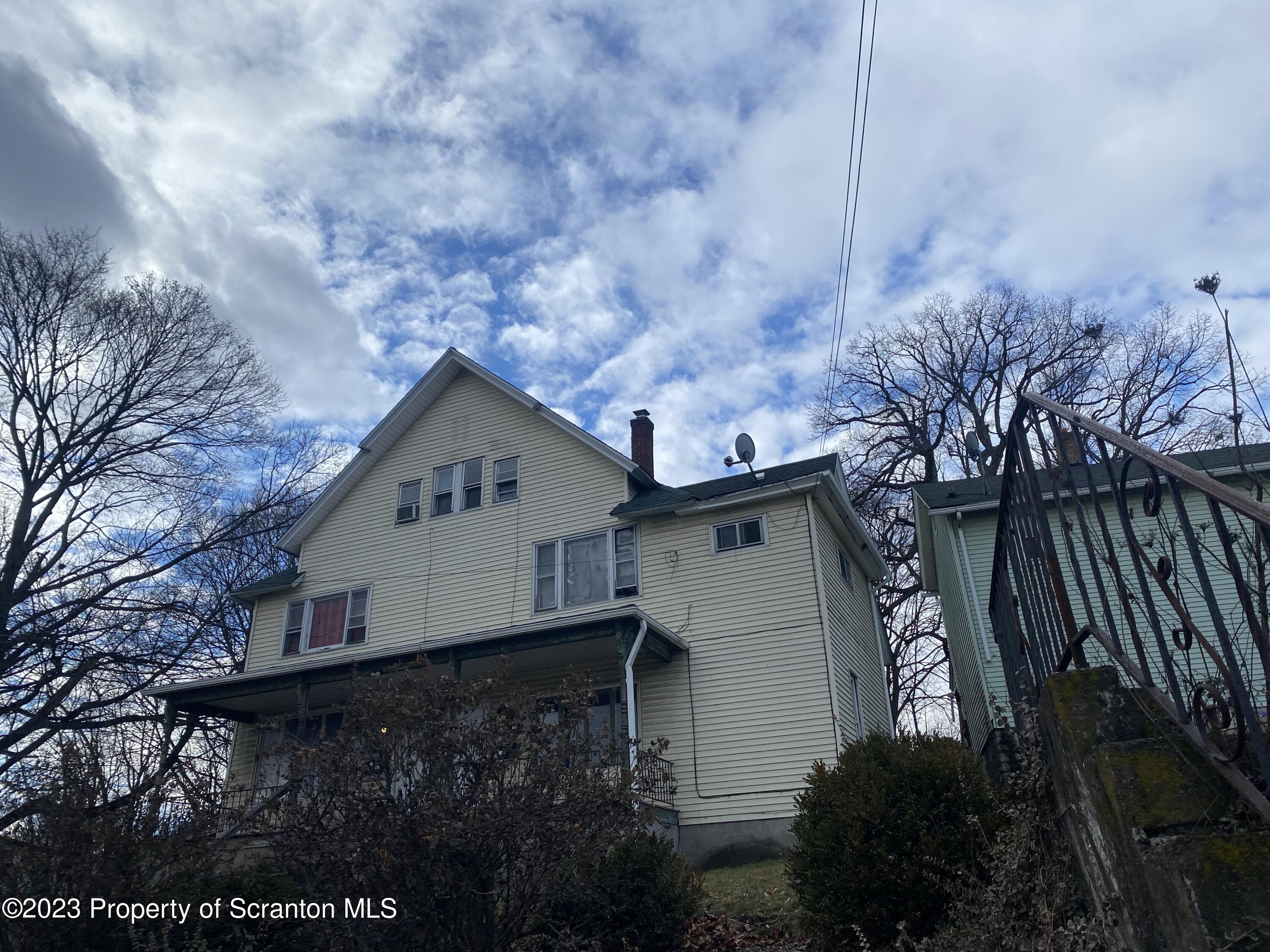 2513 North Main Avenue Scranton, PA 18508 - Photo 3 of 17 a view of house with backyard and trees