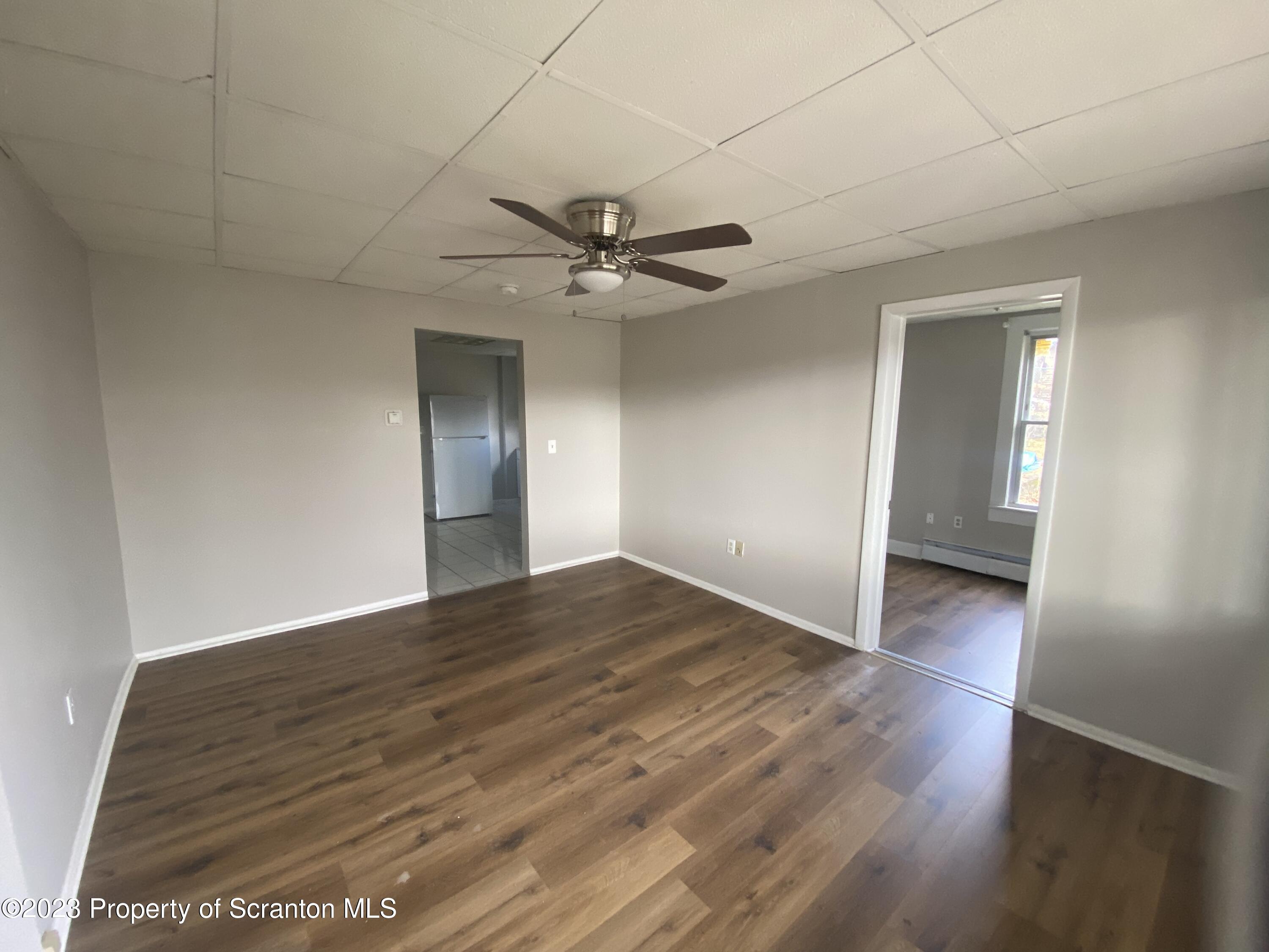 2513 North Main Avenue Scranton, PA 18508 - Photo 7 of 17 wooden floor in an empty room with a window