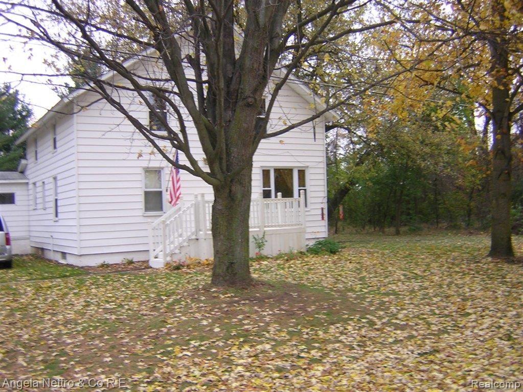 14299 Tuttle Hill Road Milan, MI 48160 - Photo 1 of 21 FRONT WITH PORCH