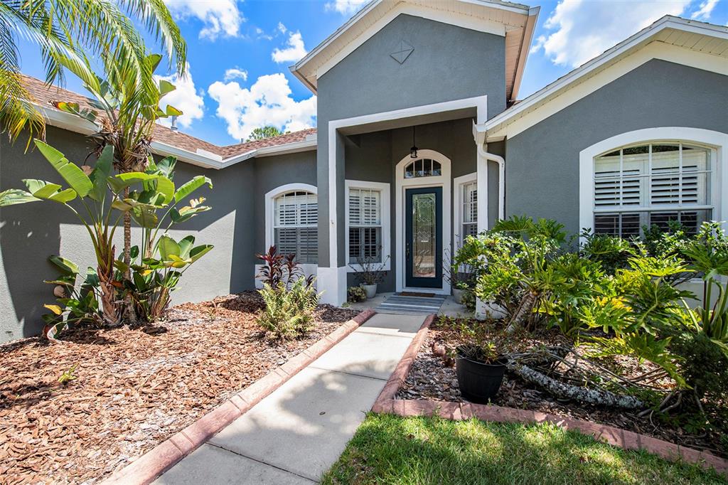 19211 Pelican Ridge Lane Tampa, FL 33647 - Photo 1 of 1 a front view of a house with a yard