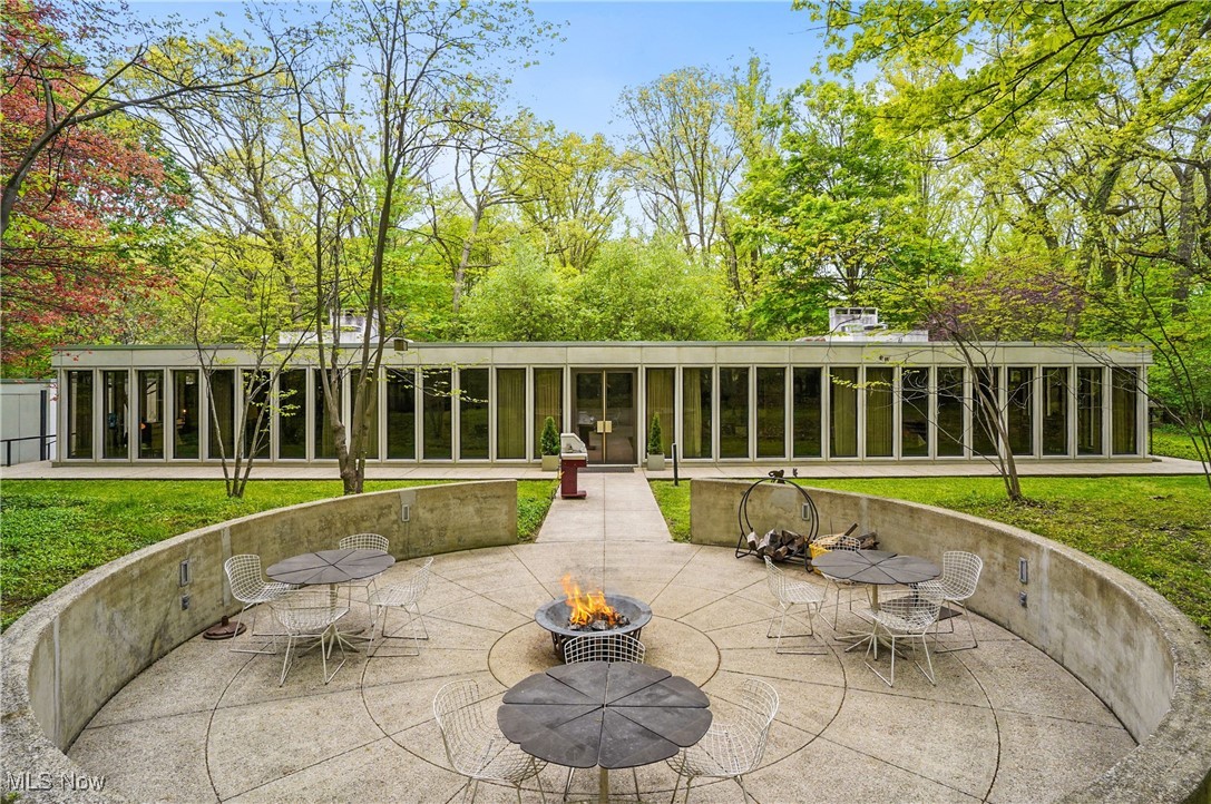 3210 North Dover Road Stow, OH 44224 - Photo 35 of 44 View of patio with an outdoor fire pit and a sunroom