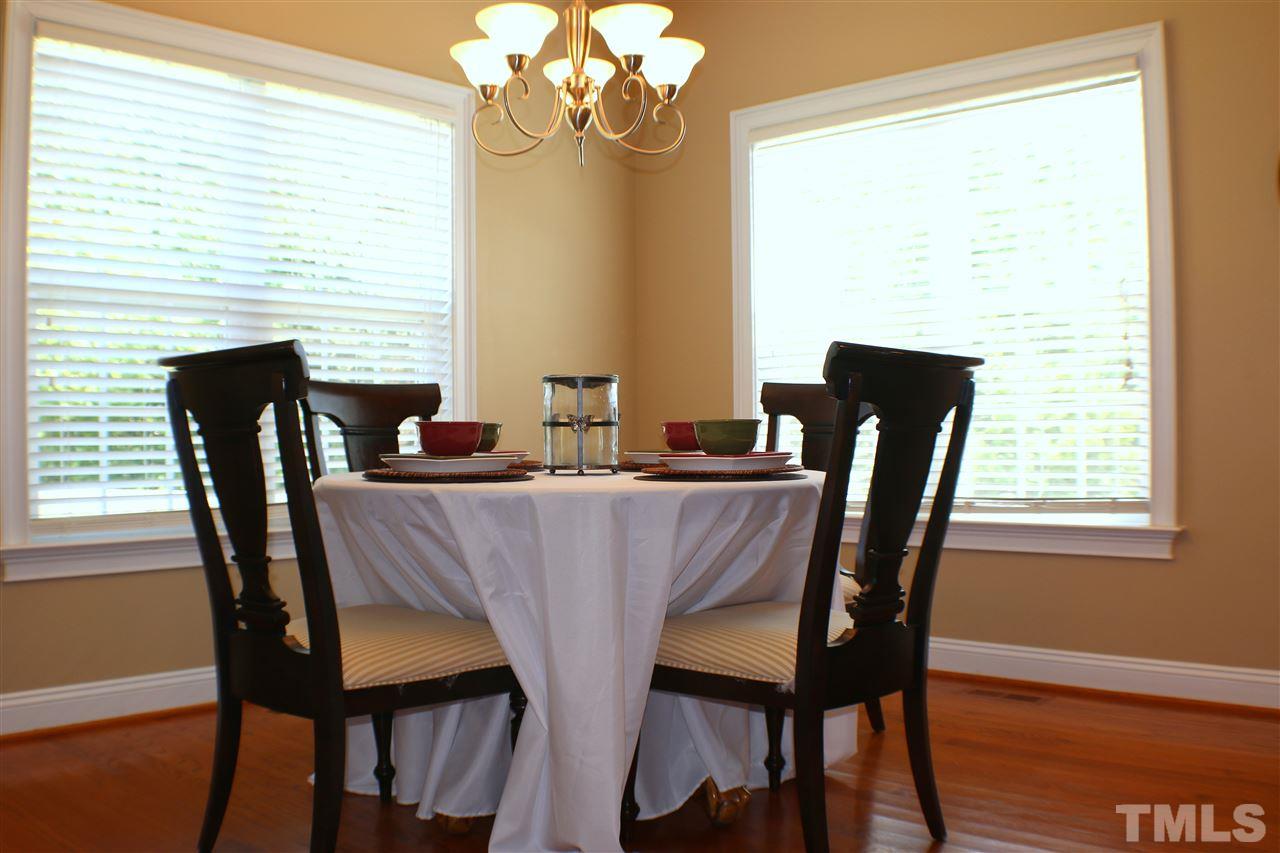 820 Hood Farm Road Clayton, NC 27520 - Photo 17 of 20 Located just off the Updated Kitchen, this breakfast room features HARDWOOD FLOORS, overlooks the large back yard, & access to the SCREENED PORCH.