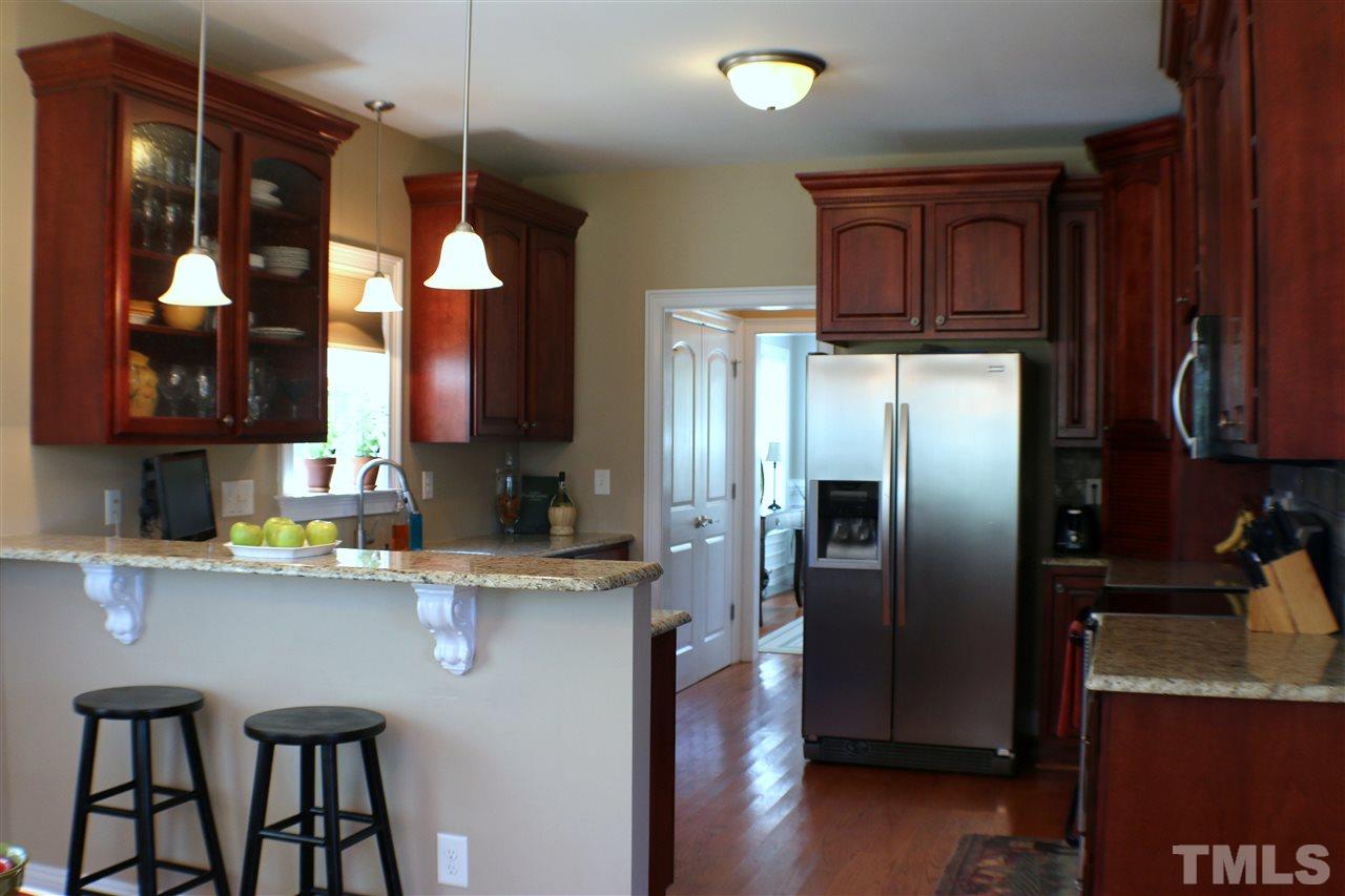 820 Hood Farm Road Clayton, NC 27520 - Photo 4 of 20 You will love this updated Kitchen with GRANITE COUNTER TOPS, smooth top range, STAINLESS STEEL APPLIANCES, breakfast bar, HARDWOOD FLOORS, & breakfast room.
