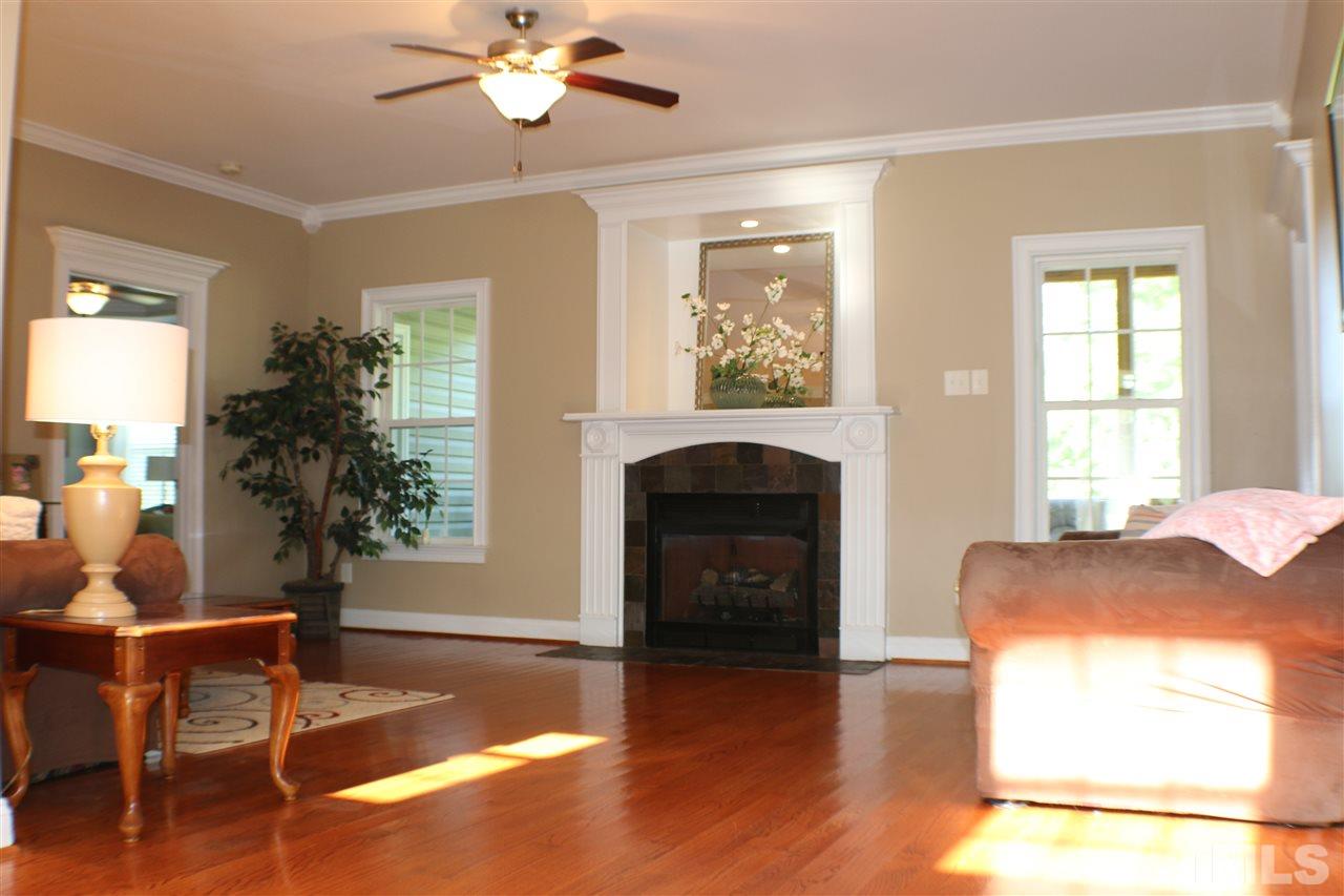 820 Hood Farm Road Clayton, NC 27520 - Photo 5 of 20 This is just one of the many living areas. It features HARDWOOD FLOORS, ceiling fan, GAS FIREPLACE, & overlooks the beautiful back yard.