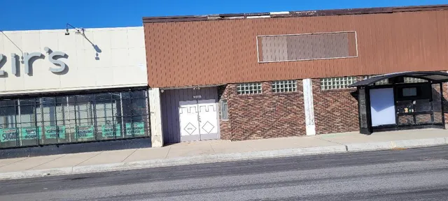 a view of a brick building with many windows