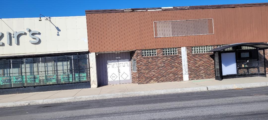 a view of a brick building with many windows