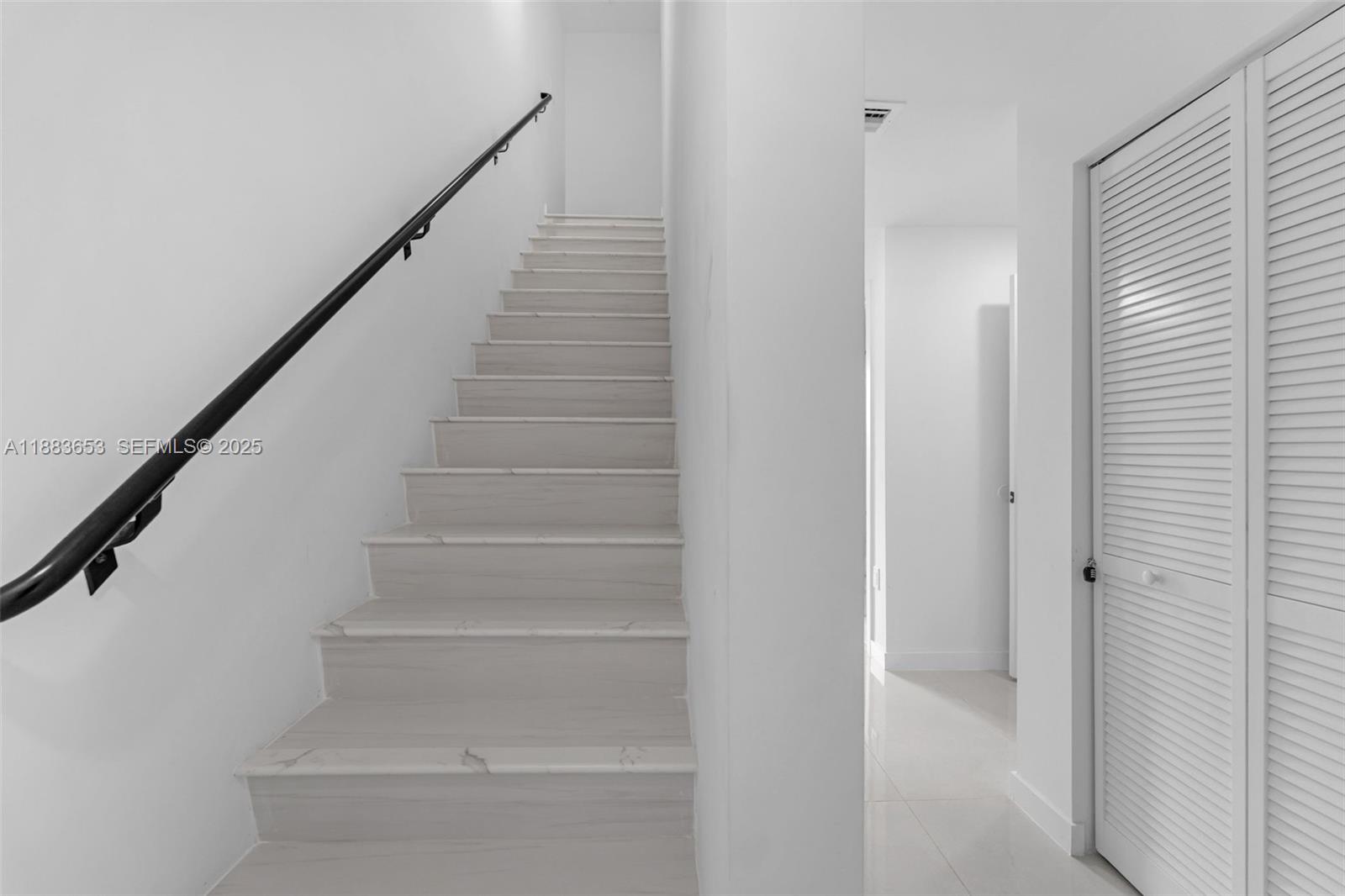 26144 Southwest 146th Court Homestead, FL 33032 - Photo 14 of 35 Elegant staircase leading to the Roof Top with modern finishes.