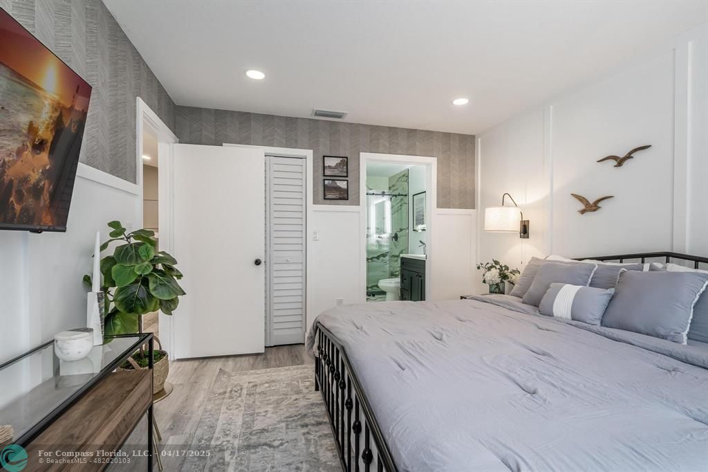 Undisclosed Address Davie, FL 33314 - Photo 11 of 23 a bedroom with a bed and a potted plant