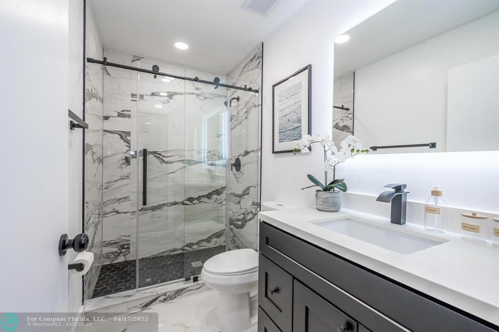 Undisclosed Address Davie, FL 33314 - Photo 12 of 23 a bathroom with a sink a toilet and shower