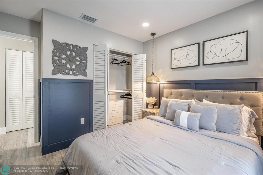 Undisclosed Address Davie, FL 33314 - Photo 15 of 23 a bedroom with a large bed and a window