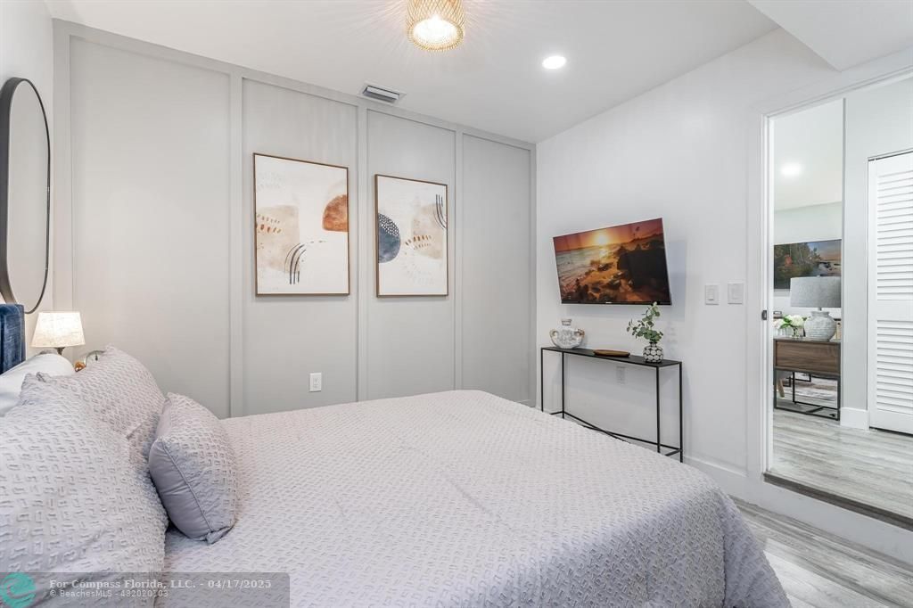 Undisclosed Address Davie, FL 33314 - Photo 18 of 23 a bedroom with a bed and a flat screen tv