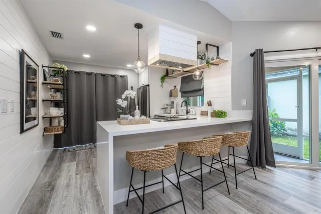a kitchen with a table and chairs in it