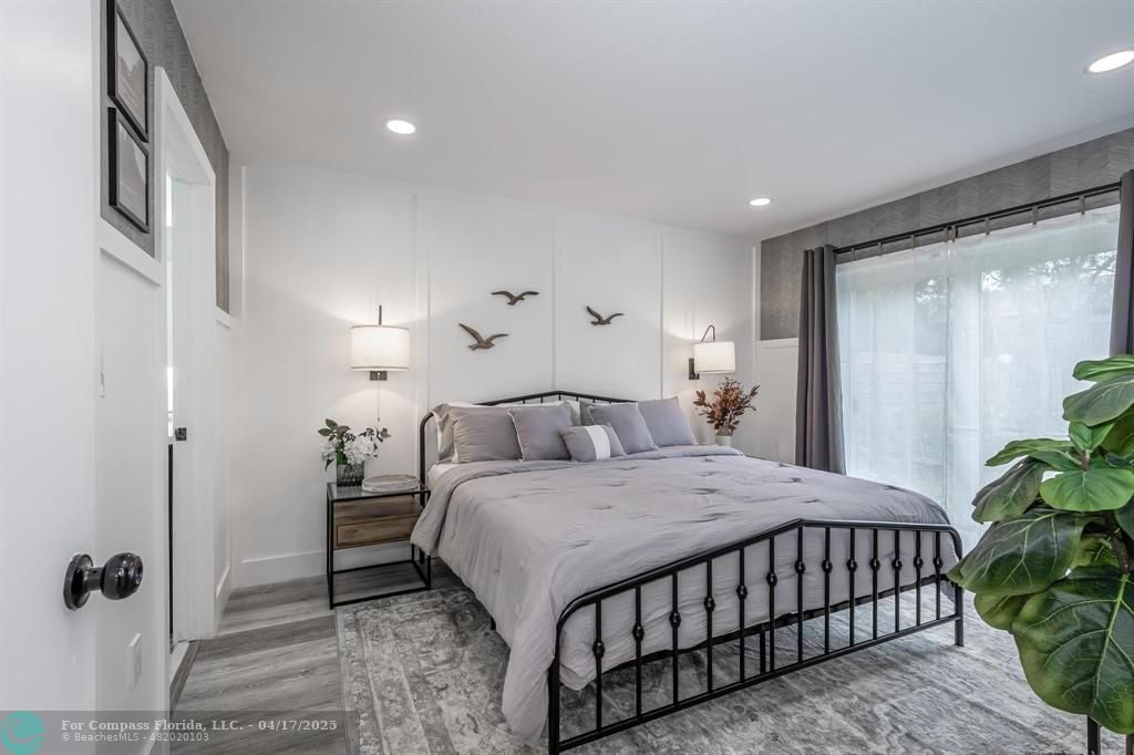 Undisclosed Address Davie, FL 33314 - Photo 9 of 23 a bedroom with a bed and a potted plant