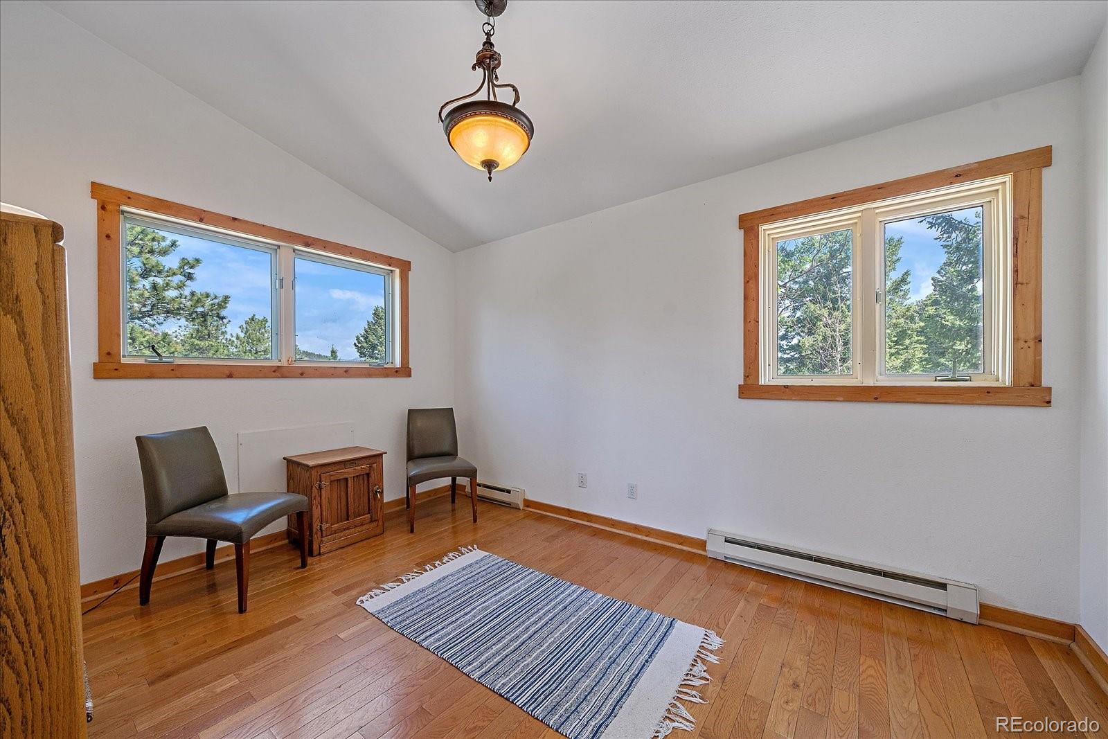 14482 Jubilee Trail Pine, CO 80470 - Photo 32 of 40 a view of a livingroom with furniture and lamp