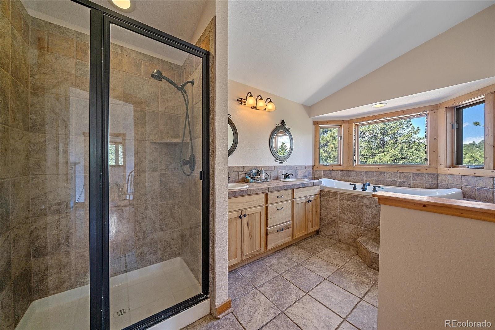 14482 Jubilee Trail Pine, CO 80470 - Photo 33 of 40 a kitchen with a sink and a refrigerator