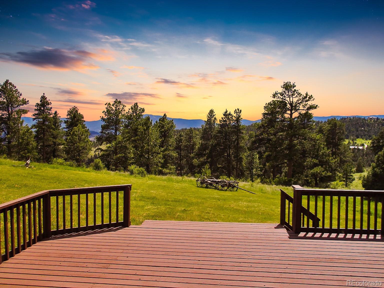 14482 Jubilee Trail Pine, CO 80470 - Photo 7 of 40 a view of a swimming pool and a yard