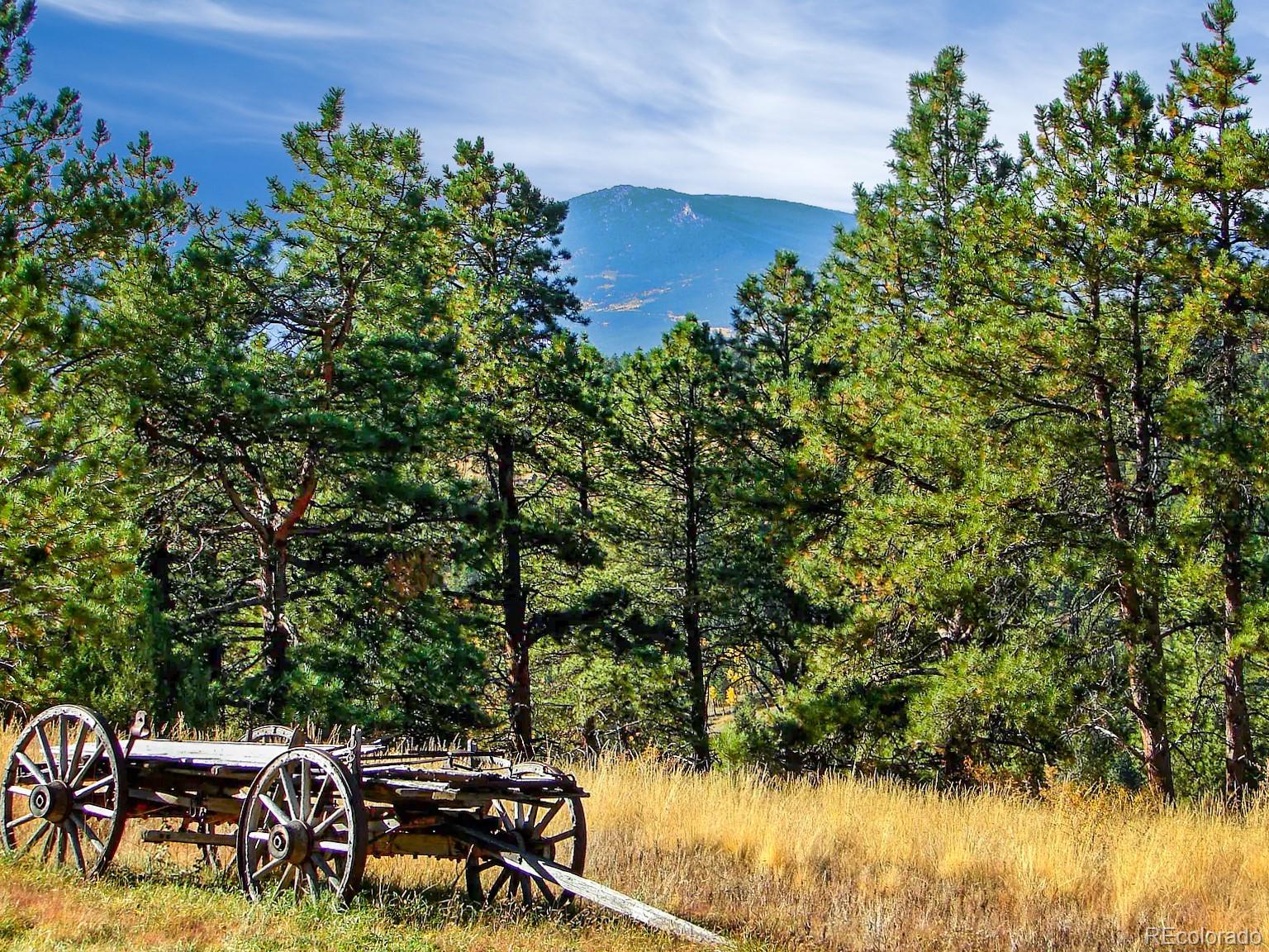 14482 Jubilee Trail Pine, CO 80470 - Photo 8 of 40 a view of a lake with outdoor seating