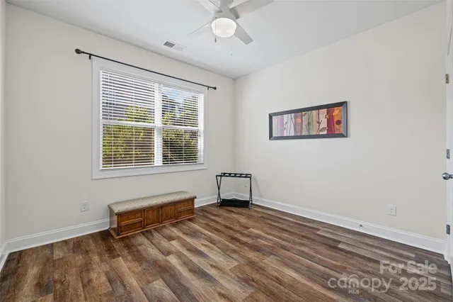 a view of room with window and ceiling fan