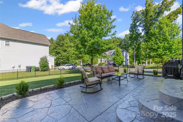 a view of a table and chairs in the garden