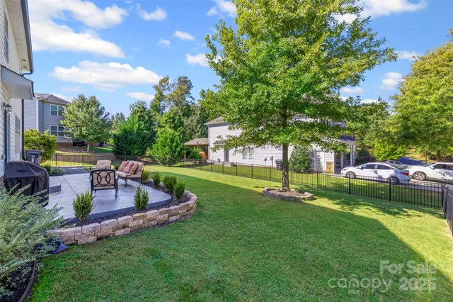 a view of a garden with lawn chairs
