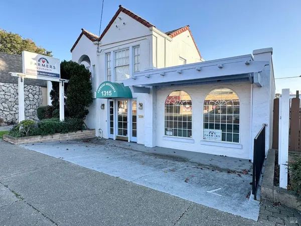 front view of a house with a large window