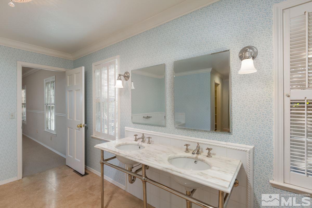 2512 Lake Ridge Shores Circle Reno, NV 89519 - Photo 11 of 25 a bathroom with a sink and a mirror