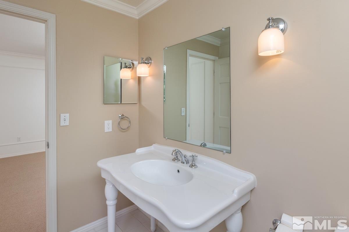 2512 Lake Ridge Shores Circle Reno, NV 89519 - Photo 17 of 25 a bathroom with a sink and a mirror