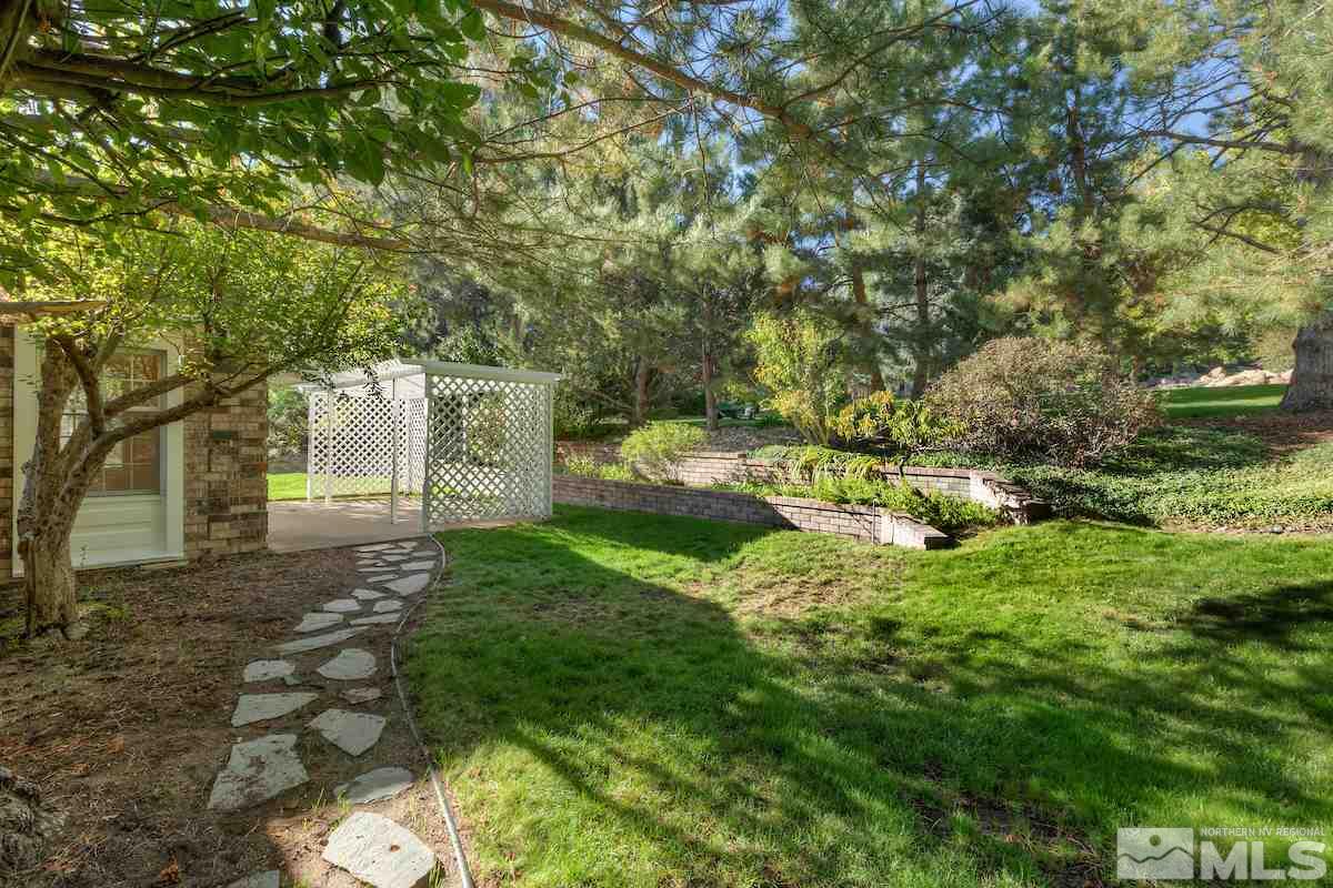 2512 Lake Ridge Shores Circle Reno, NV 89519 - Photo 22 of 25 a backyard of a house with lots of green space