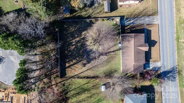 a brick building with a tree in front of it