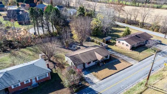 an aerial view of a house with outdoor space