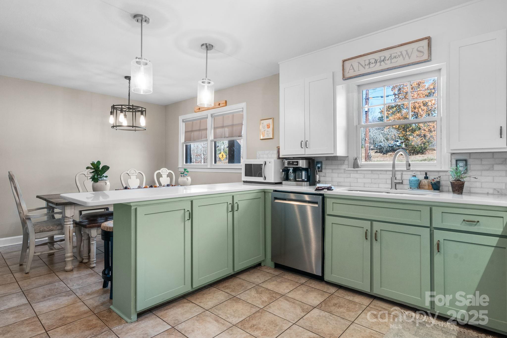 631 Powell Road Northeast Lenoir, NC 28645 - Photo 26 of 38 a kitchen with a sink and cabinets