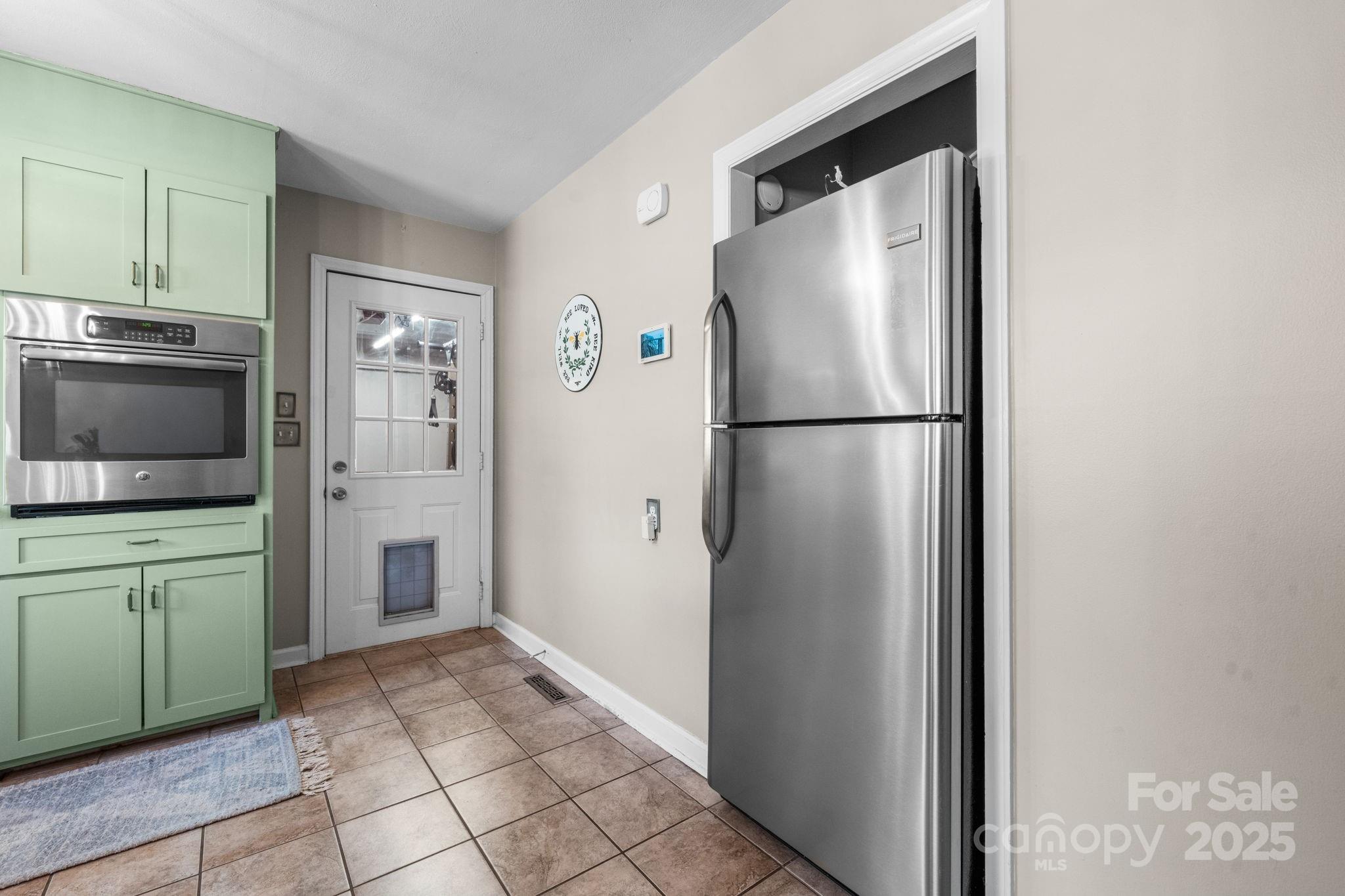 631 Powell Road Northeast Lenoir, NC 28645 - Photo 27 of 38 a white refrigerator freezer sitting in a kitchen