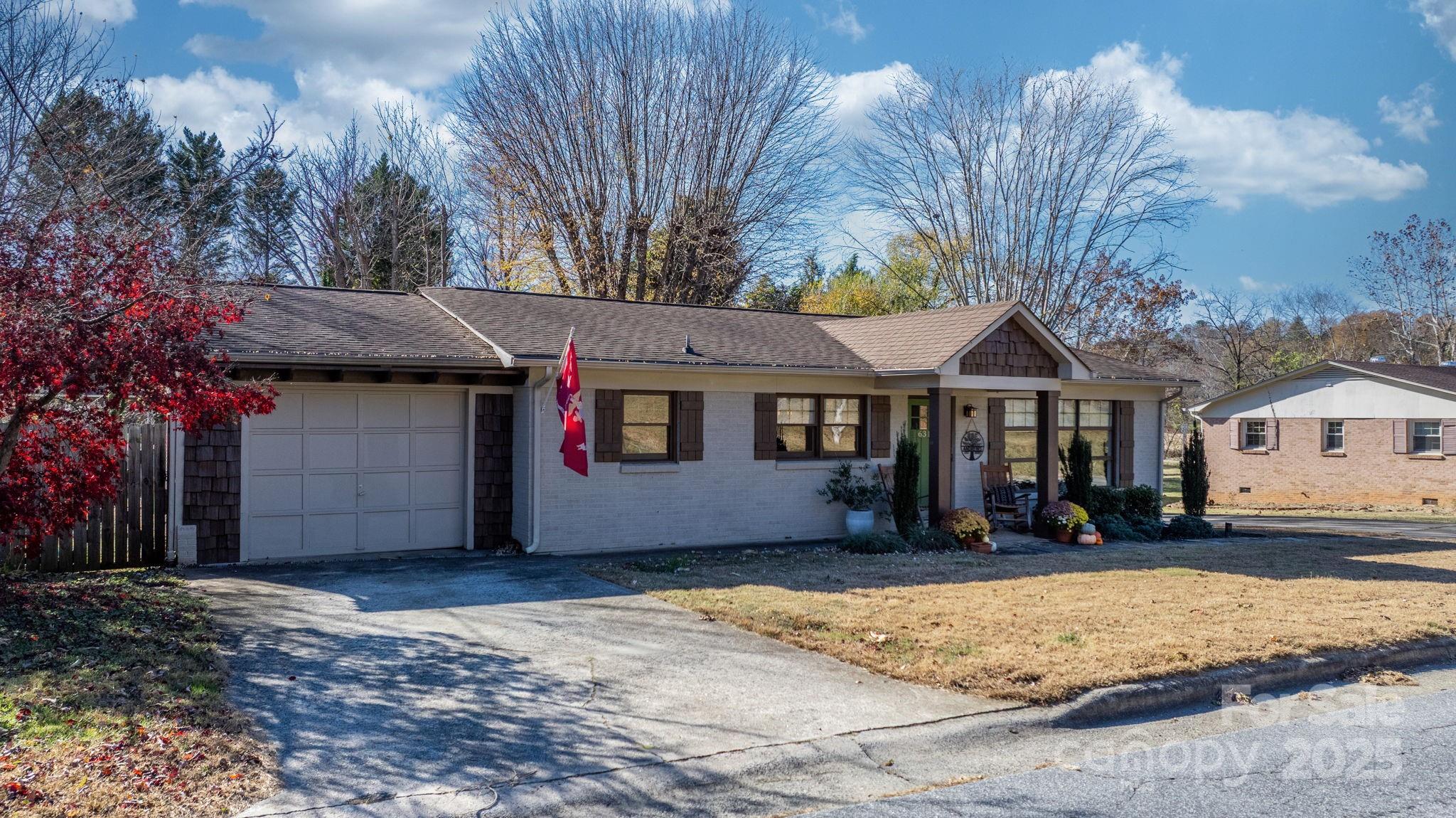 631 Powell Road Northeast Lenoir, NC 28645 - Photo 3 of 38 a front view of a house with a yard