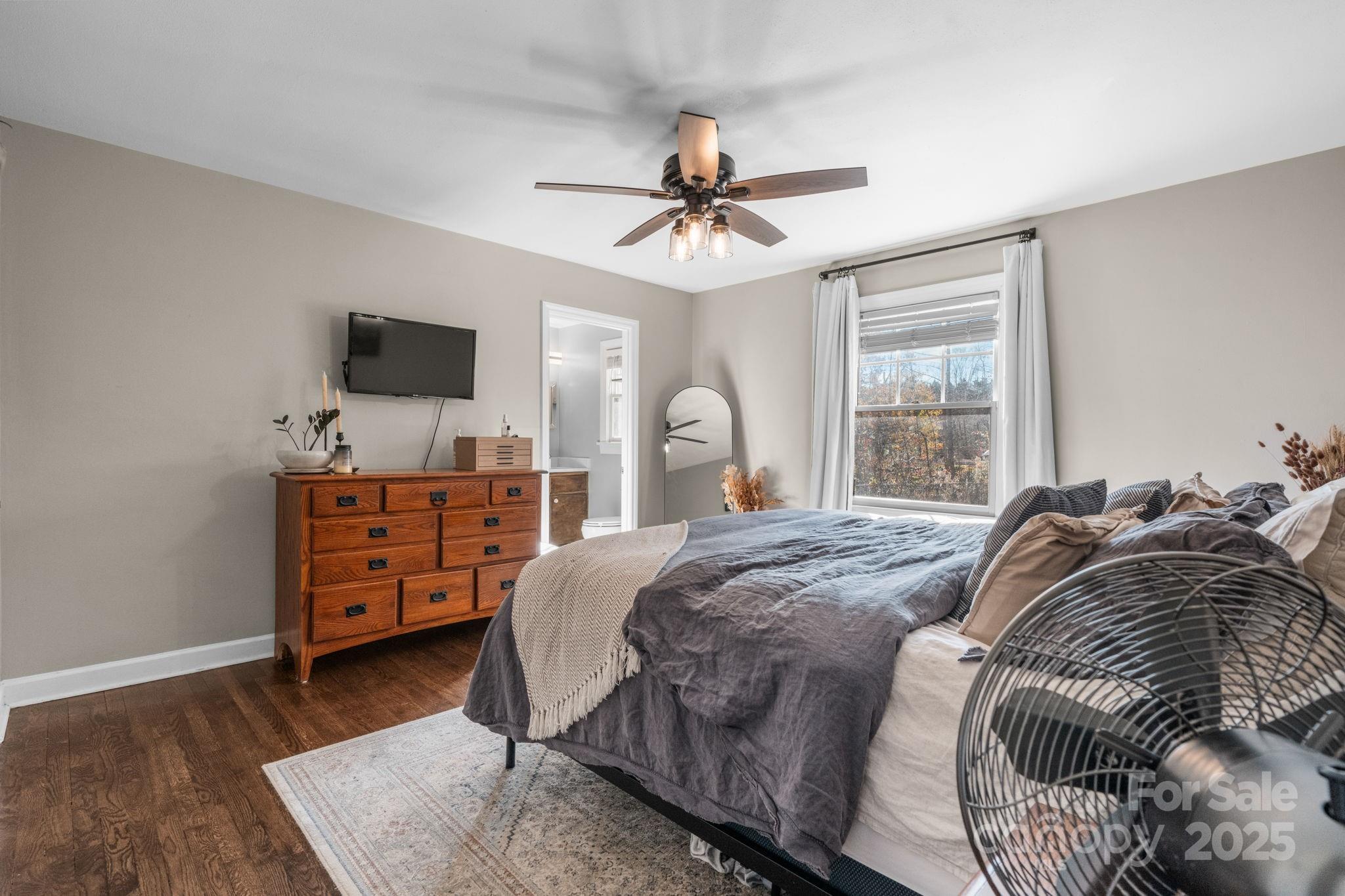 631 Powell Road Northeast Lenoir, NC 28645 - Photo 31 of 38 a bedroom with a bed and wooden floor