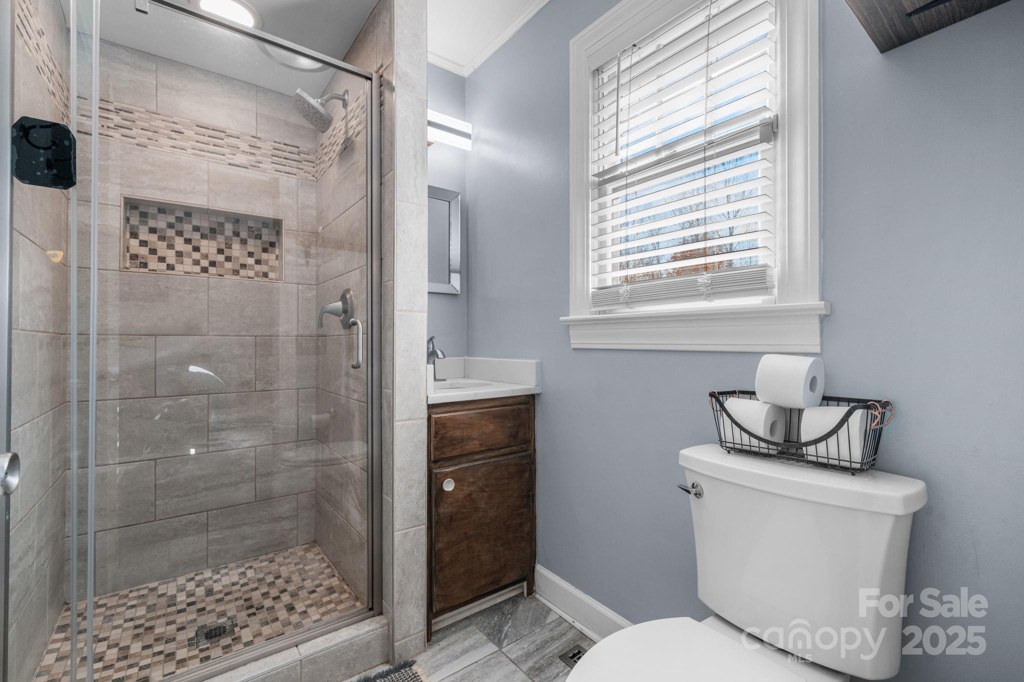 631 Powell Road Northeast Lenoir, NC 28645 - Photo 33 of 38 a bathroom with a toilet and a shower