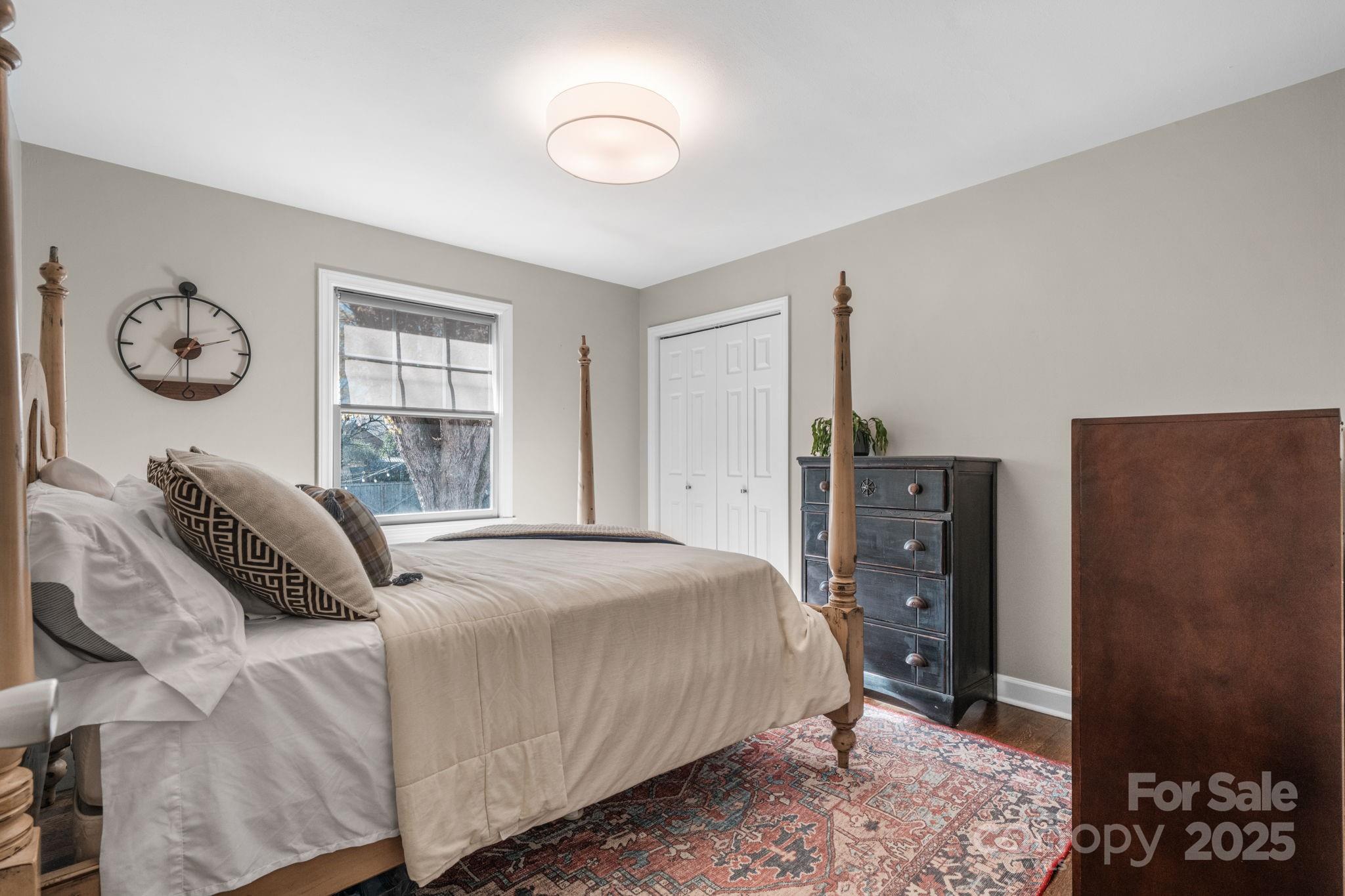 631 Powell Road Northeast Lenoir, NC 28645 - Photo 34 of 38 a bedroom with a bed and wooden floor