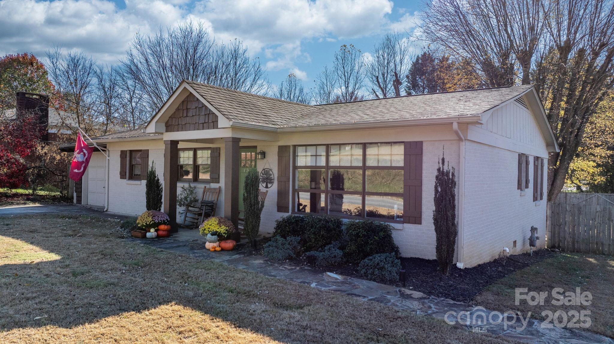 631 Powell Road Northeast Lenoir, NC 28645 - Photo 5 of 38 a view front of house with a yard